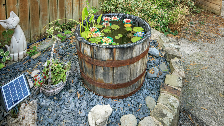 A water feature made from an old barrel