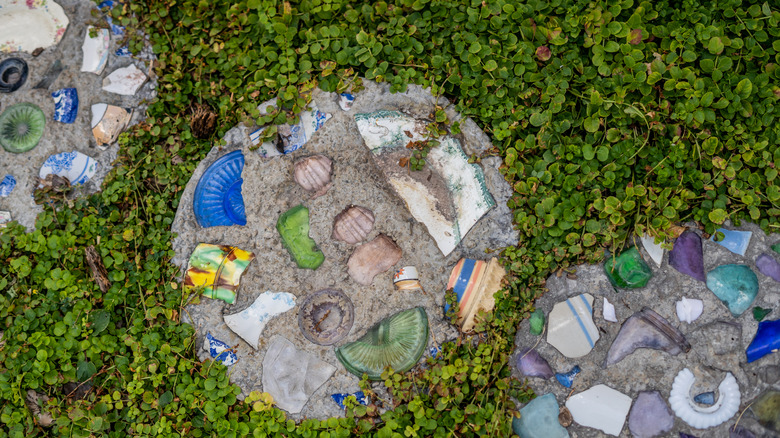 Homemade mosaic stepping stones in clover
