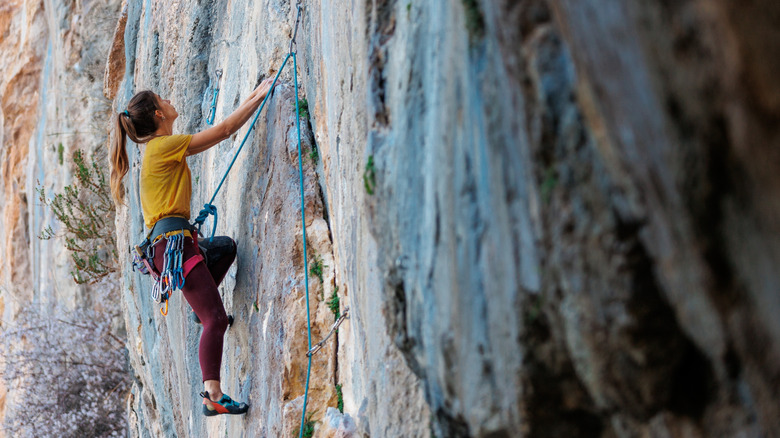 Woman rock climbing