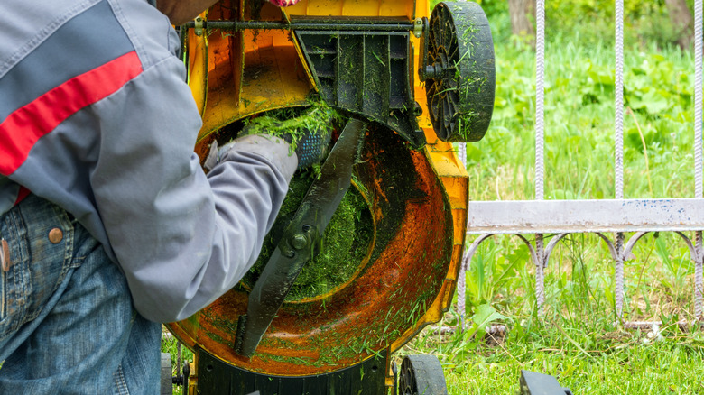 cleaning out clogged mower deck