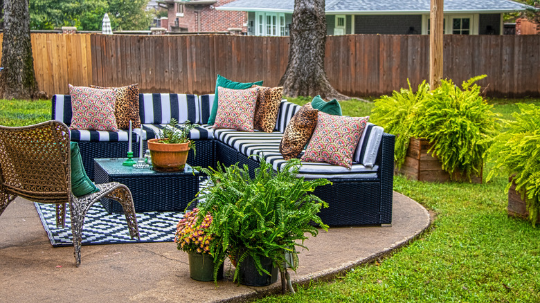 Couch with rug and cushions on a patio