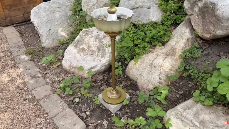 A DIY birdbath made from a thrifted stand and a Bundt pan