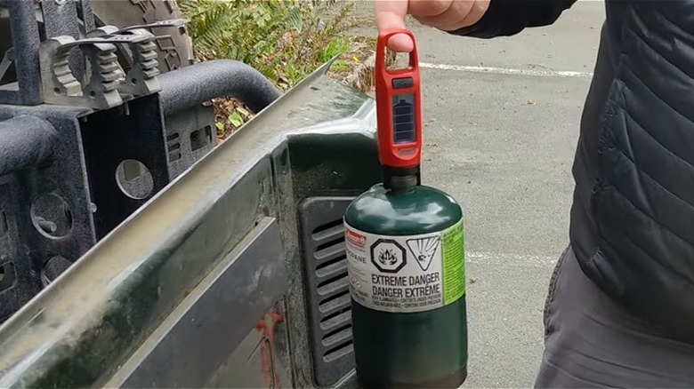 Propane tank for camping with a Walmart fuel gauge on top