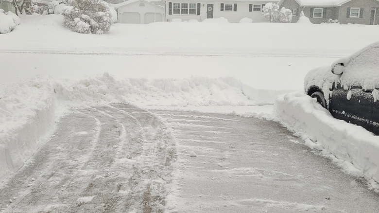 Icy driveway with lots of snow