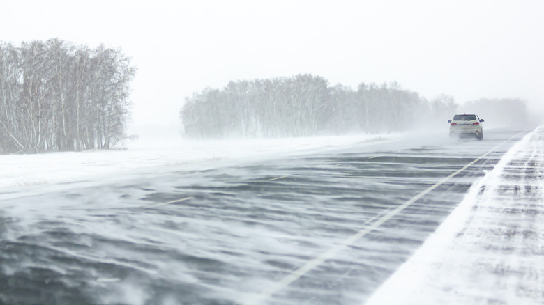 Car driving in a snow squall