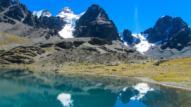 The Cordillera Real mountains rise sharply in the distance