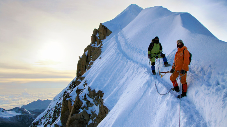 Climbers on a snowy ridge of Huayna Potosi