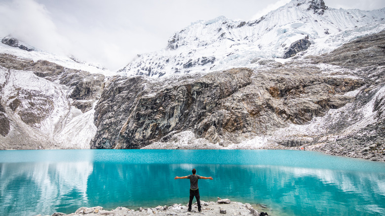 A hiker enjoying the view of Laguna 69