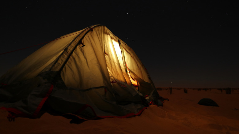 Tent on dunes, camping at night
