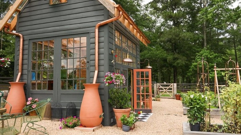 Rainwater urns collecting water from downspouts