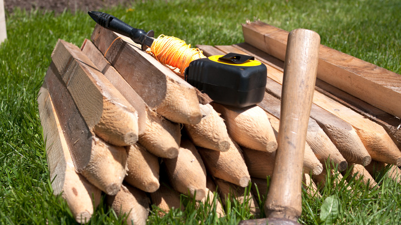 String, stakes, a hammer, and measuring tape