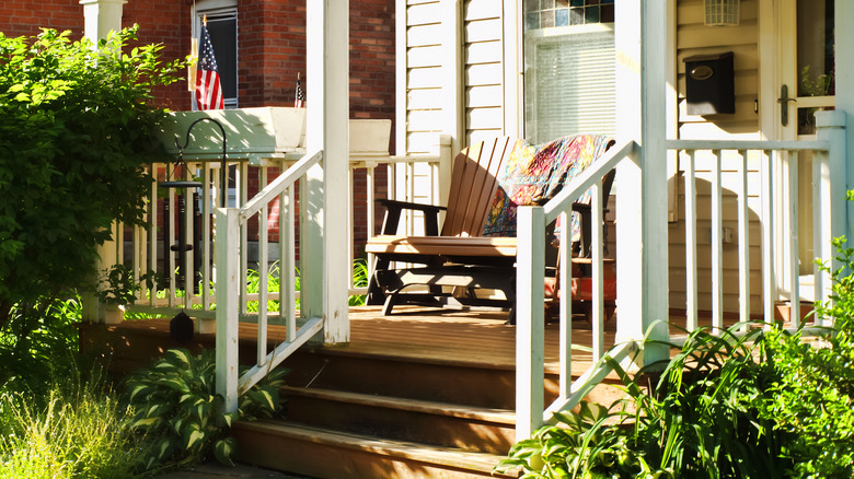 front porch of a wooden house on a sunny day