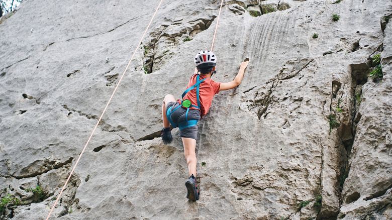 Boy rock climbing