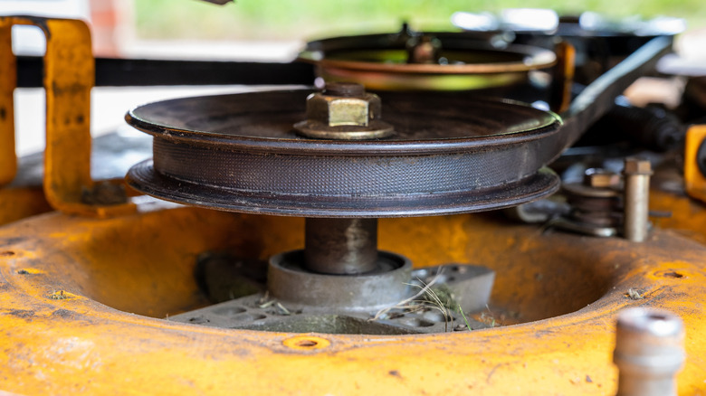 Pulleys on mower deck spindle assembly