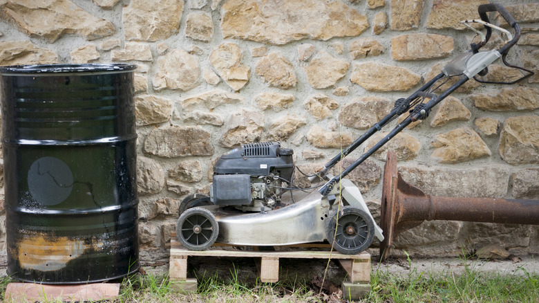 lawn mower elevated behind wall