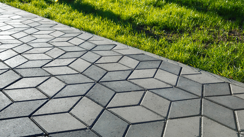 Path of rhombus pavers through the grass
