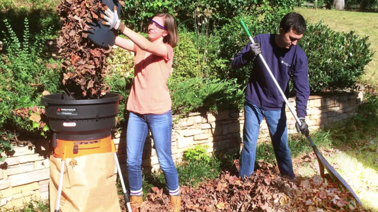 Couple using the Yard Force electric leaf shredder