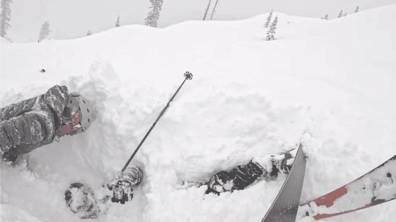 Carson Schmidt and Eric Masuda rescue a buried skier