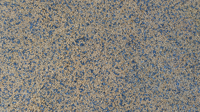 Rubber pellet paving material