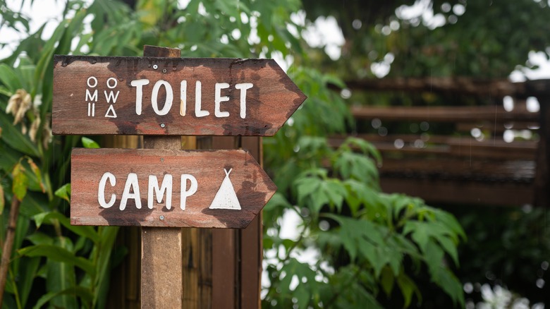 Wooden toilet sign