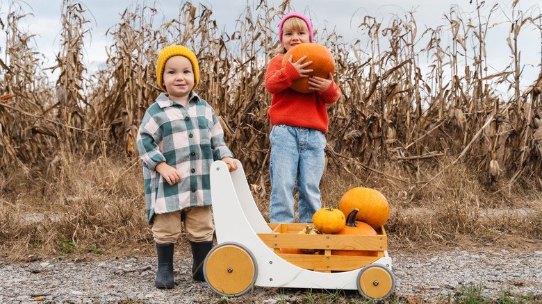Two kids with their pumpkins