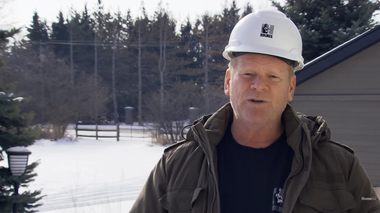 Mike Holmes in snowy yard and driveway