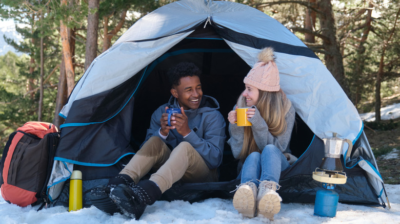 Couple camping during winter