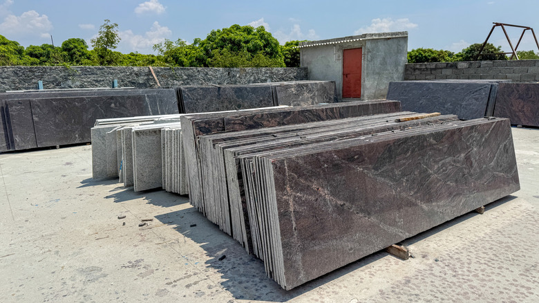Granite slabs outside behind warehouse
