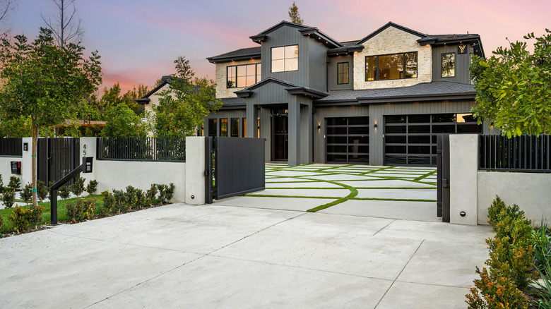 A large home with a massive driveway