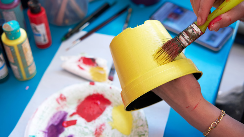 painting a plant pot yellow
