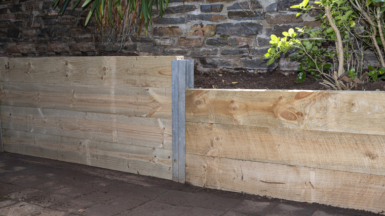 Wood retaining wall patio
