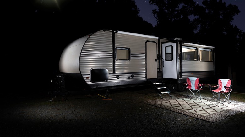 An Rv with exteriors lights blazing