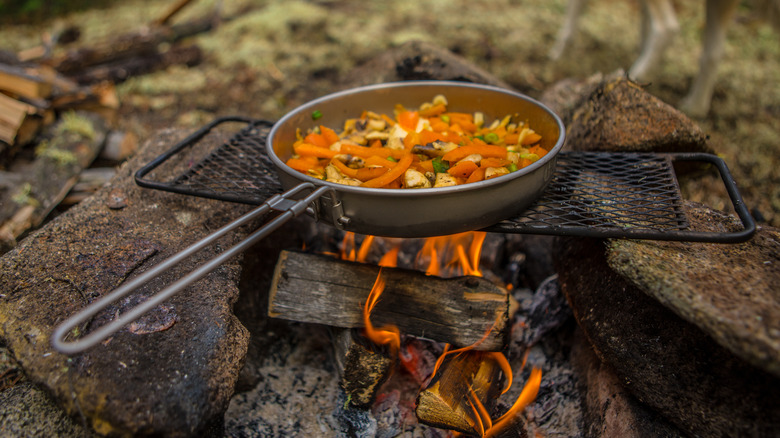 Veggies cooking over campfire