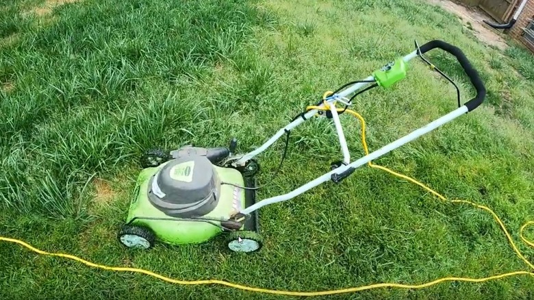 Greenworks 18" electric corded mower getting ready to mow the grass