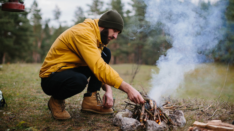 Man building a campfire