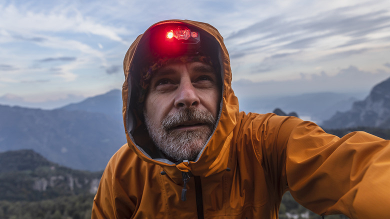 Someone outside with a red headlamp