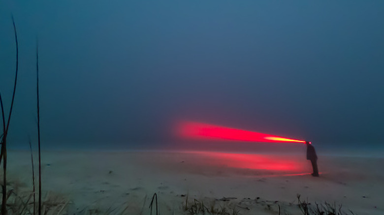 Man with red lens headlamp