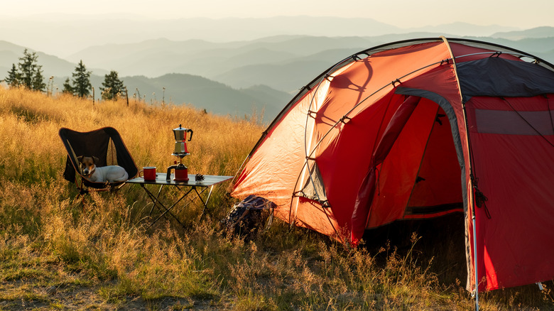 Campsite on a hill overlooking mountains