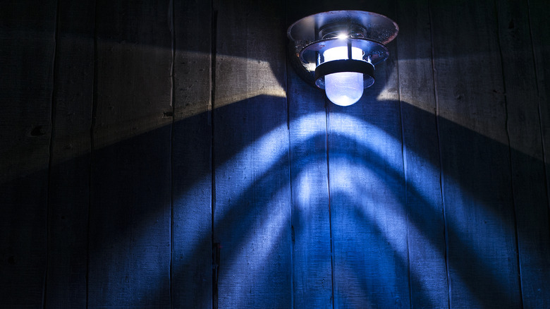 A blue lamp shining in the night