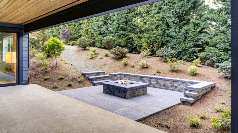 patio with fire pit and slate tiles