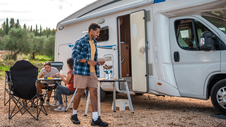 RV campers cooking and eating