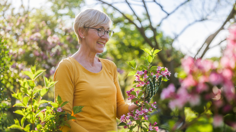 Woman looking at healthy plants