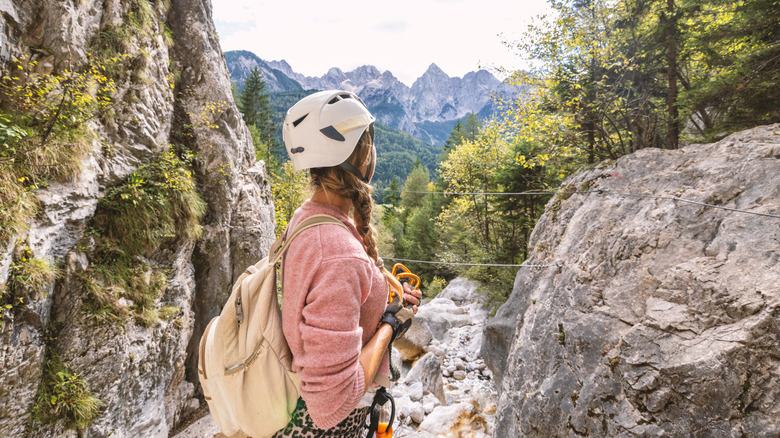 Woman looking at via ferrata course