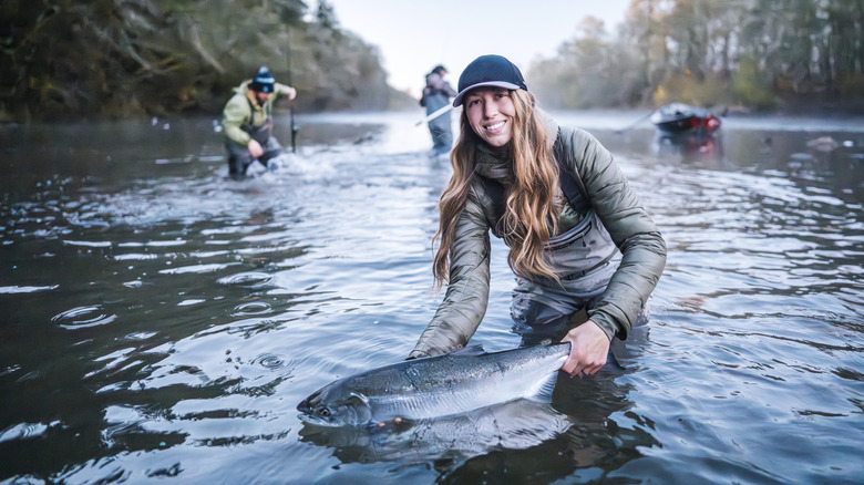 Angler holding salmon caught during fall