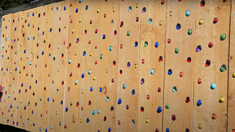 Marbles as wooden fence decor