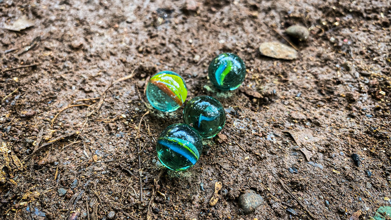 marbles sitting on the ground outside