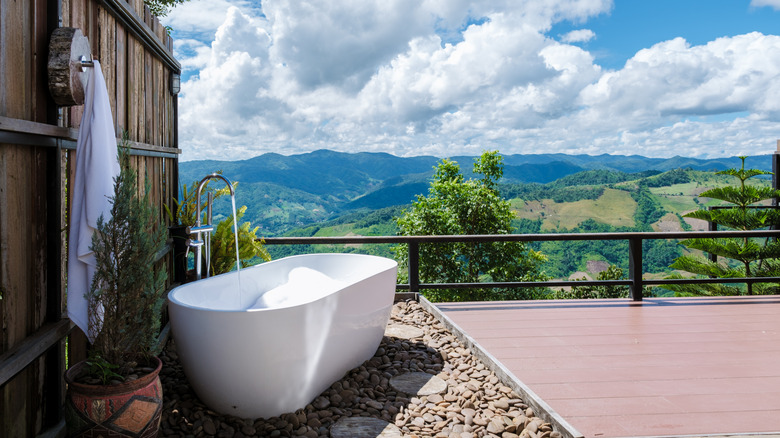 Outdoor soaking tub with mountain view