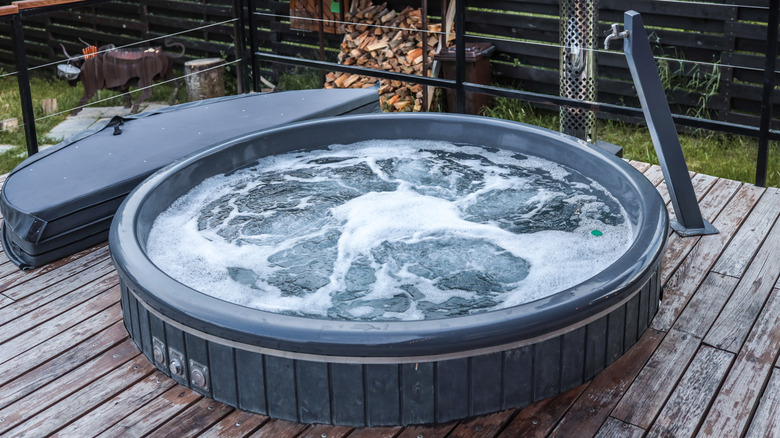 Round outdoor hot tub on deck