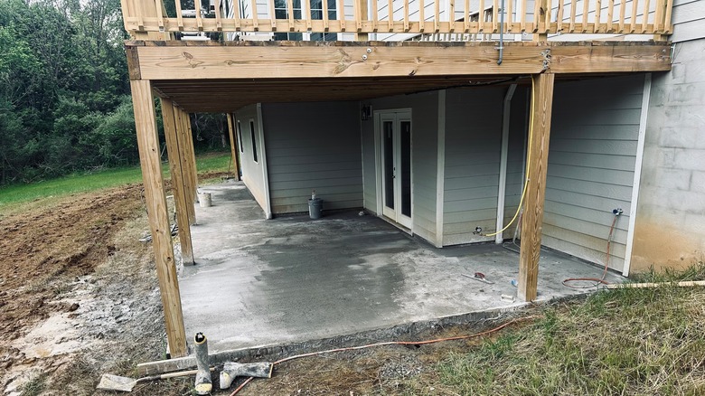 New concrete pad installed under deck
