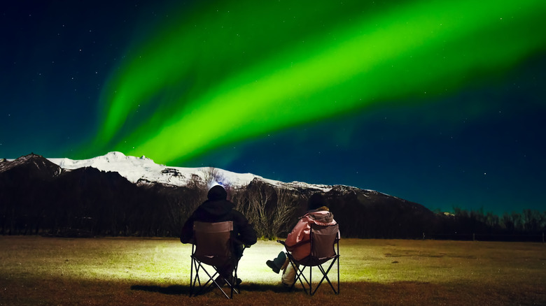 Couple watching northern lights